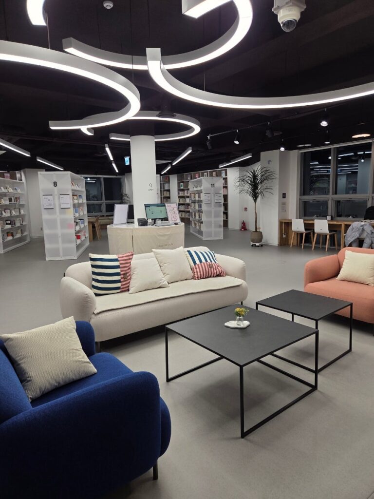 A modern Korean public library with lounge seats and bookshelves